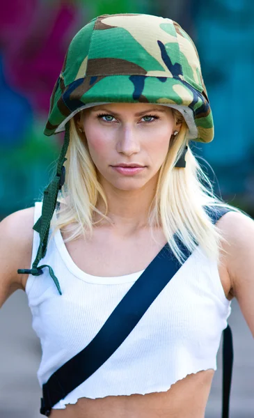 Woman with army helmet — Stock fotografie