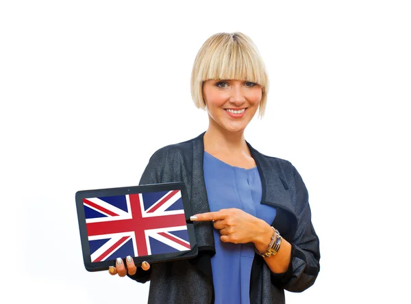 Attraktive blonde Frau mit Tablette mit der Flagge des Vereinigten Königreichs — Stockfoto