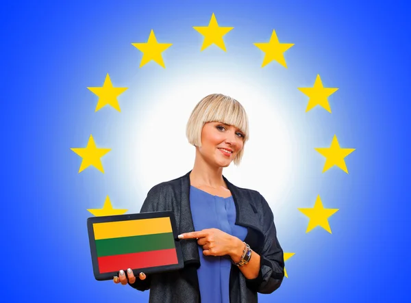 Woman holding tablet with lithuania flag on european union back — Stock Photo, Image