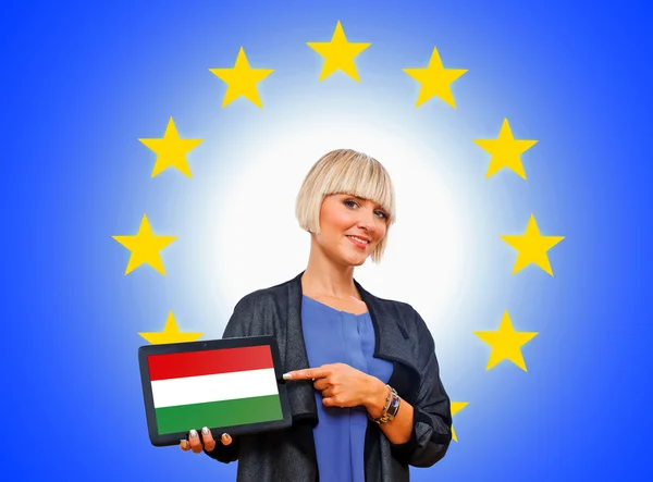 Woman holding tablet with hungary flag on european union backgr — Stock Photo, Image