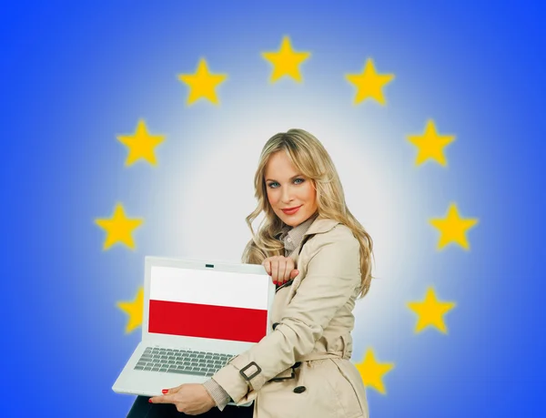 Woman holding laptop with poland flag — Stock Photo, Image