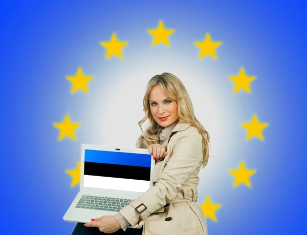 Woman holding laptop estonian with flag — Stock Photo, Image