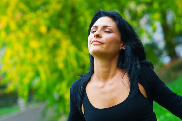 attractive woman breathing outside