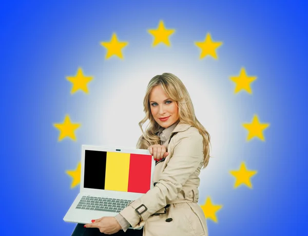 Woman holding laptop with belgium flag — Stock Photo, Image