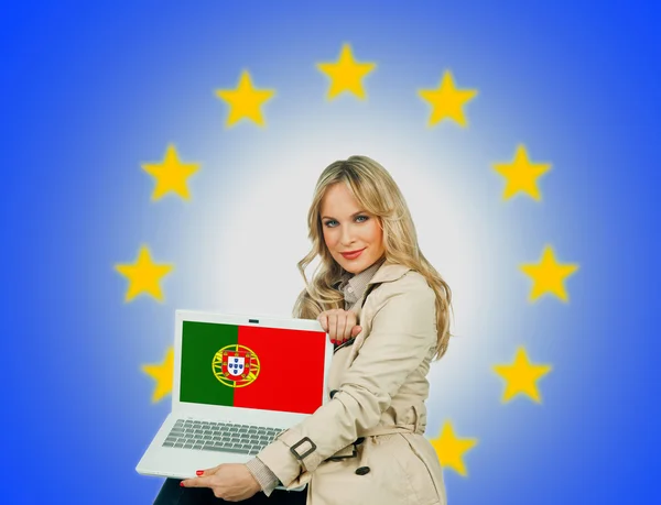 Woman holding laptop with portugal flag — Stock Photo, Image