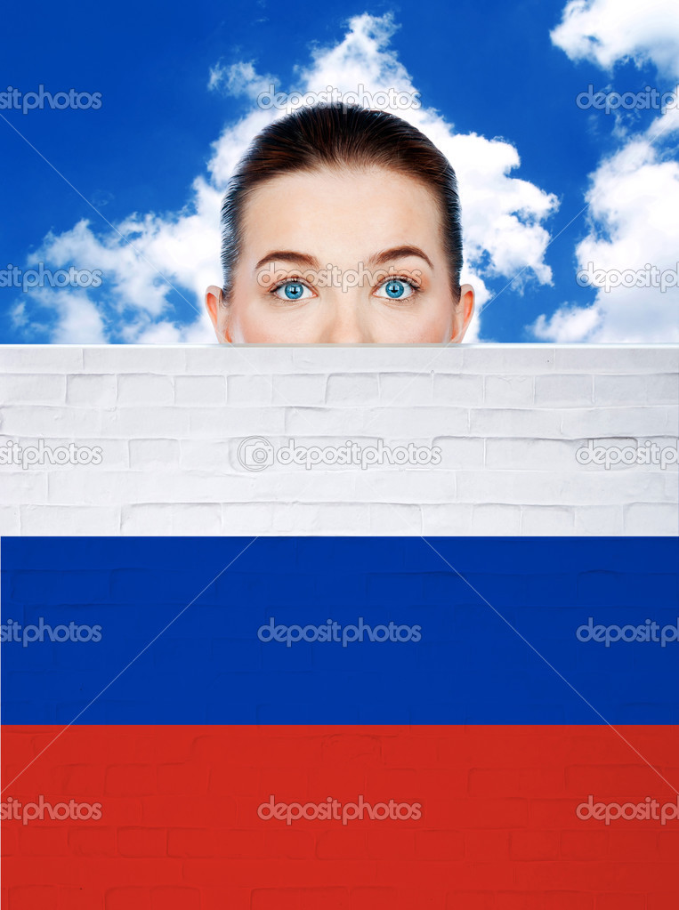 woman face behind wall with russia flag