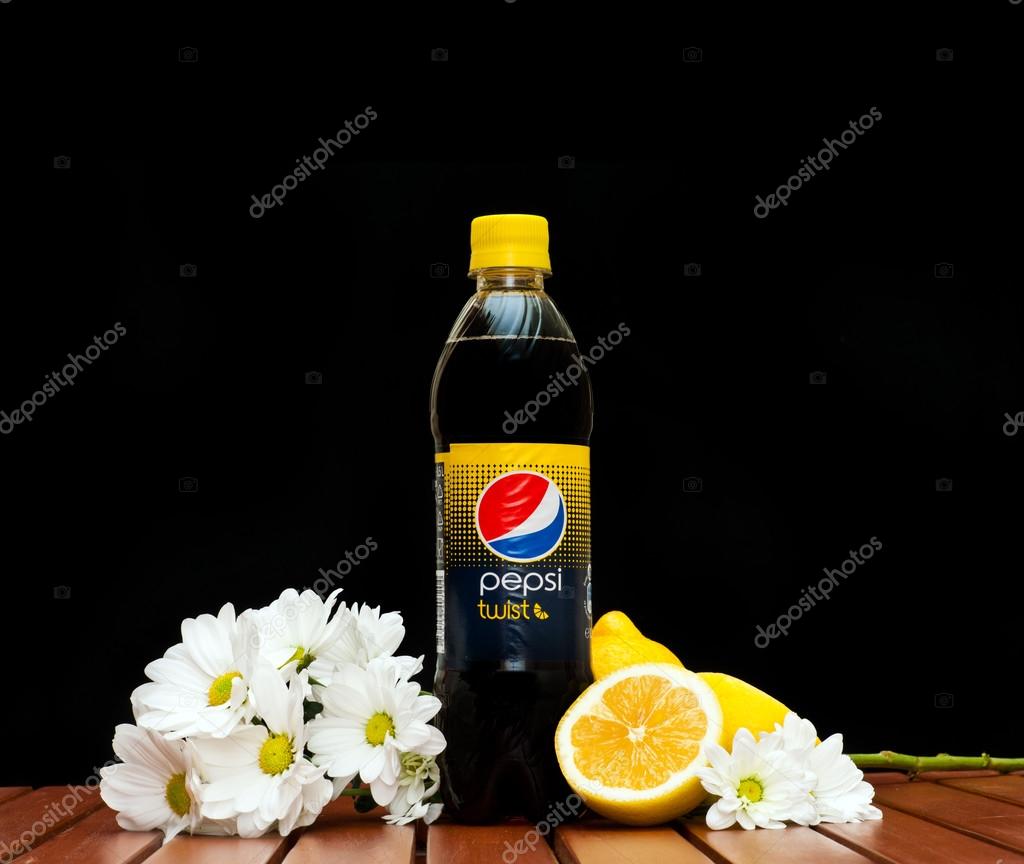 ZAGREB , CROATIA - JANUARY 24 ,2014 : plastic bottle of soft drink Pepsi twist by Pepsico company with lemon on black background, product shot