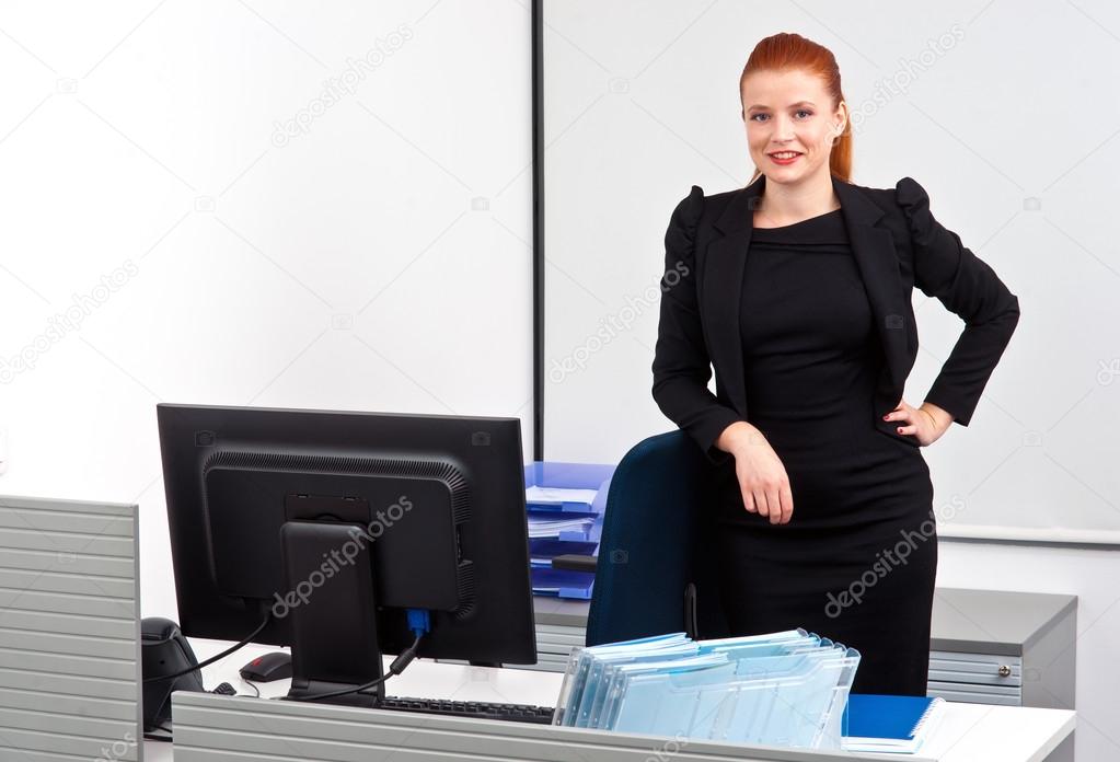 red hair business woman in office