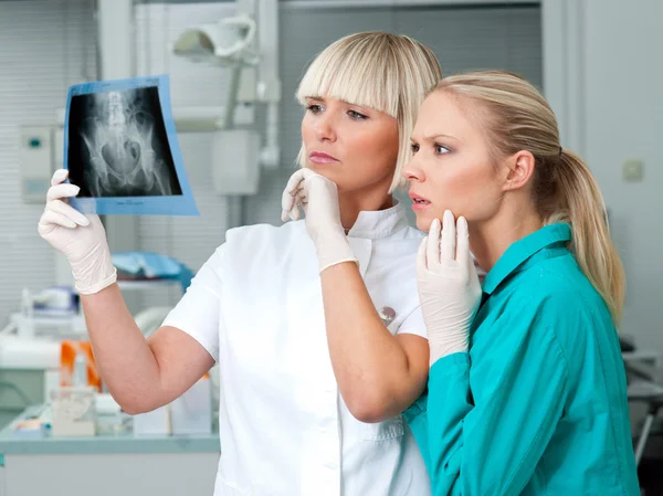 Woman doctor with her assistant — Stok fotoğraf