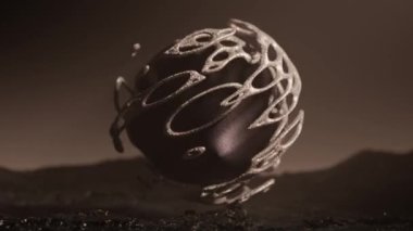 Gümüş ağdaki gizemli bir topun soyut üç boyutlu animasyonu. Fantezi tarzında cansız bir gezegenin ıssız bir manzarası..