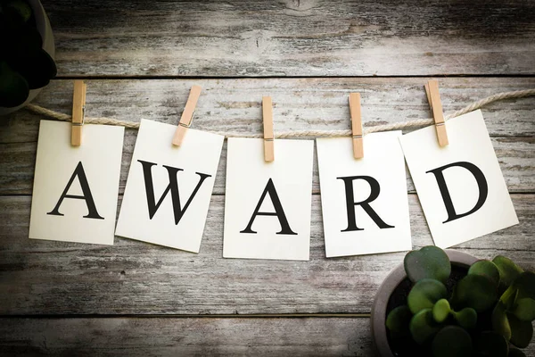 Set Printed Cards Spelling Word Award Aged Wooden Background — Stock Photo, Image