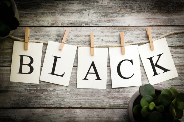 Set Printed Cards Spelling Word Black Aged Wooden Background — Stock Photo, Image