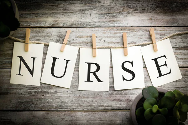 Set Printed Cards Spelling Word Nurse Aged Wooden Background — Stock Photo, Image