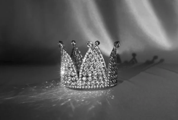 Vintage little royal crown for princess, king. Black and white photo, monochrome.