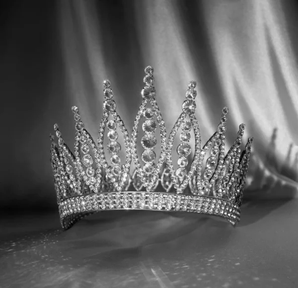 Golden contest american royal crown. Precious accessory. Queen. Black and white photo, monochrome.