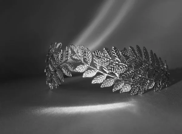 Laurel wreath, symbol of glory, victory or peace. Caesar. Black and white photo, monochrome.