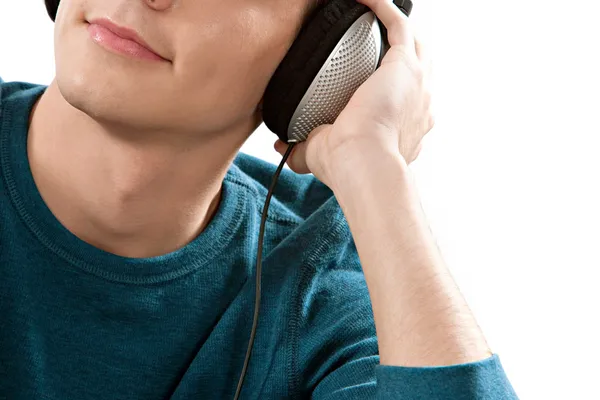 Attractive young man 's half face listening to music — стоковое фото