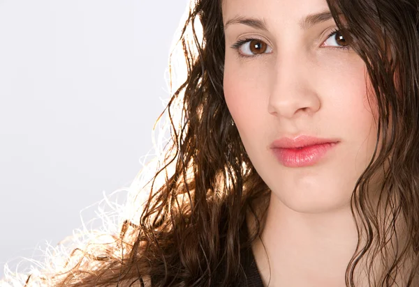 Beauty portrait of a young hispanic girl against a white background — Stock Photo, Image