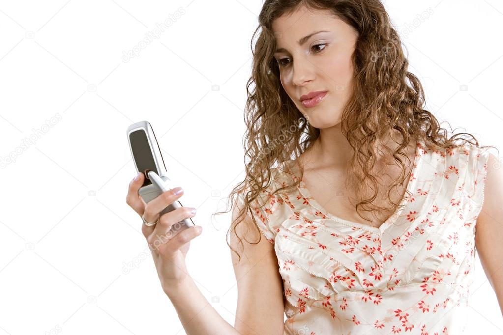 young woman holding a cell phone in her hand