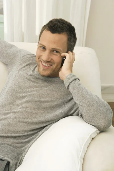 Young professional man using a cell phone — Stock Photo, Image