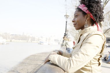 african american woman at London's river Thames clipart