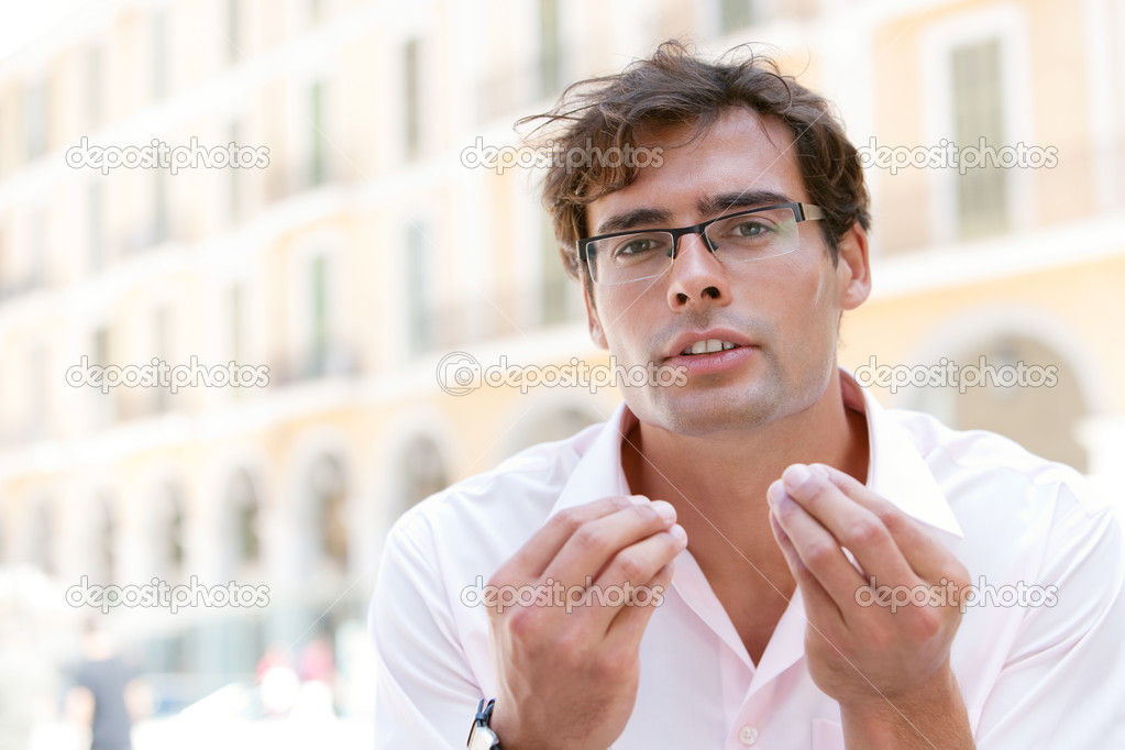 attractive businessman using his hands to express himself
