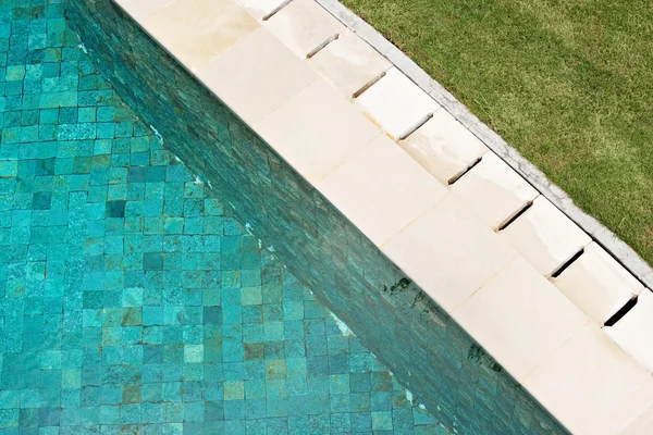 Blue swimming pool with mosaic tiles — Stock Photo, Image