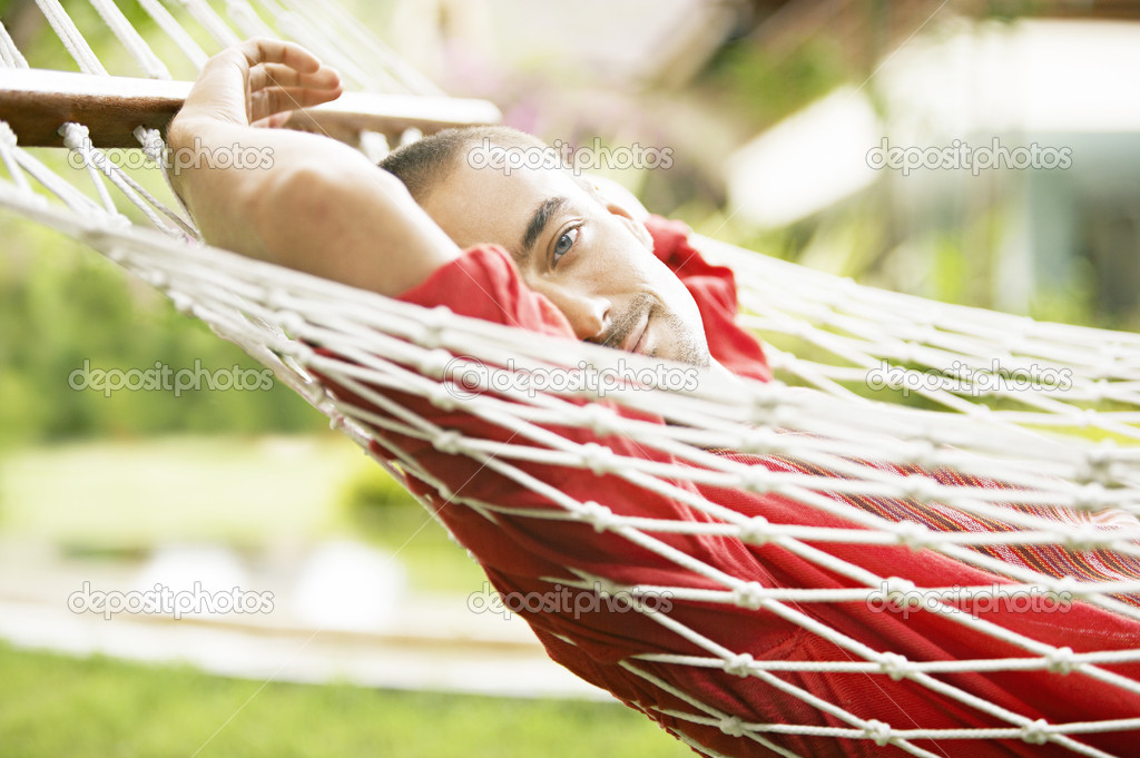 young man relaxing on a hammock