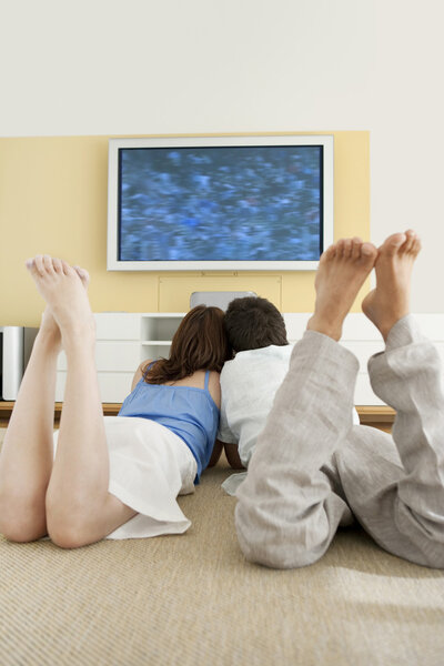 Couple watching tv together
