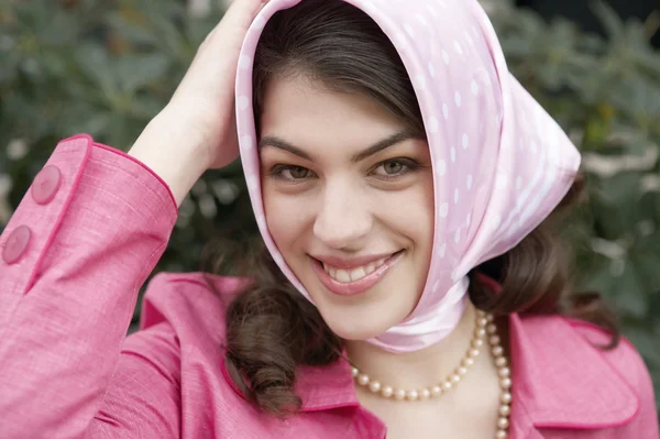 Young woman wearing a fashionable scarf on her head. — Stock Photo, Image