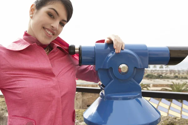 Sophisticated young woman at an observatory overlooking the city. — Stock Photo, Image