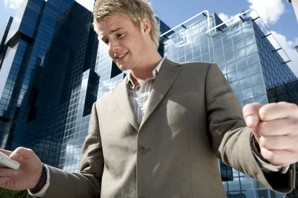 Young businessman celebrating in the city — Stock Photo, Image