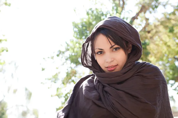 Muslim young woman wearing a brown head scarf — Stock Photo, Image