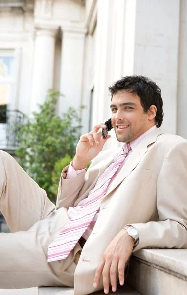 Elegant businessman having a conversation on a cell phone — Stock Photo, Image