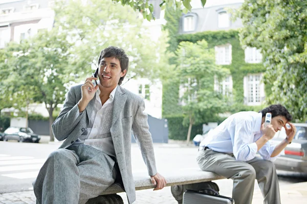 Two businessmen making phone calls on their cells — Stock Photo, Image