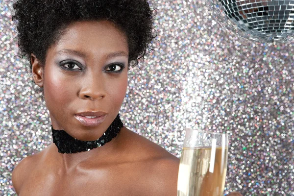 Attractive black woman holding an champagne glass Stock Photo
