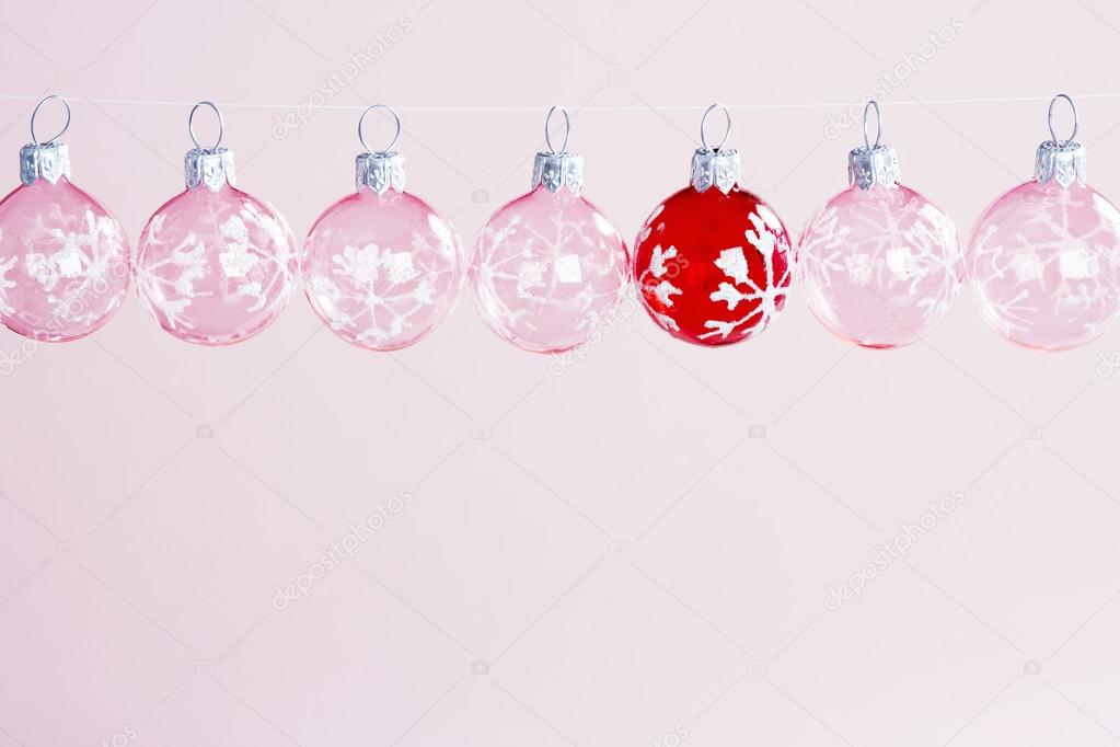 Chistmas balls hanging next to each other on a line