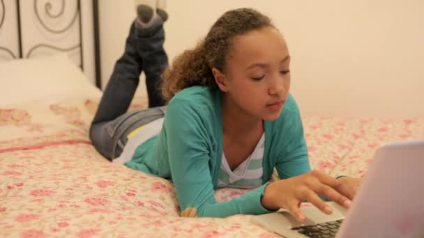 Young girl typing on her laptop — Stock Video