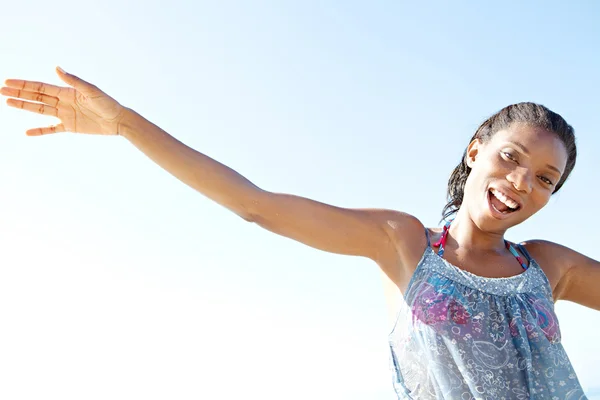 Woman smiling on a beach — Stock Photo, Image