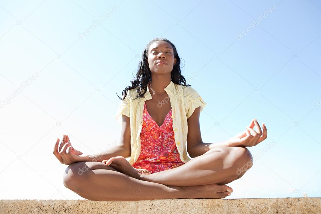 African woman meditating