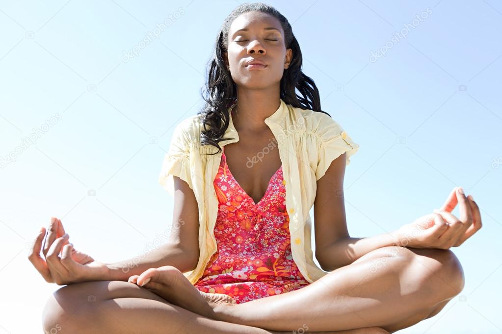 African woman meditating