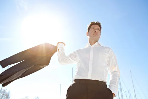 Businessman throwing his jacket — Stock Photo, Image