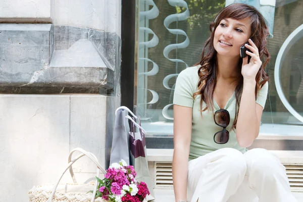 Young woman sitting — Stock Photo, Image