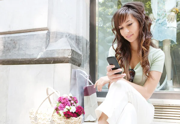 Young woman sitting — Stock Photo, Image