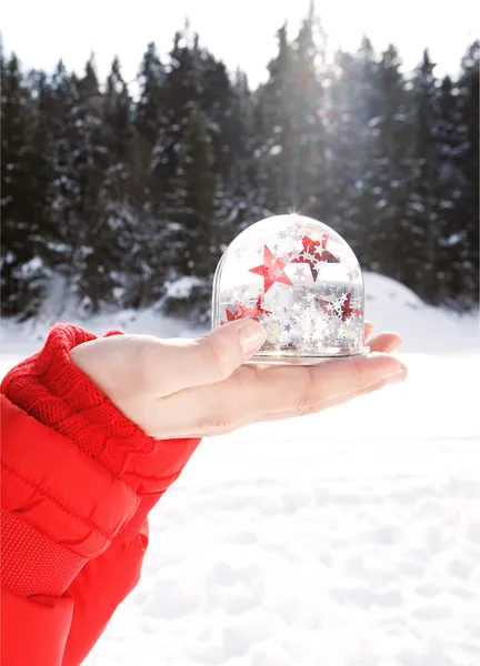 Woman holding a snow globe — Stock Photo, Image