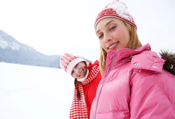 Two young women in winter outdoors — Stock Photo, Image