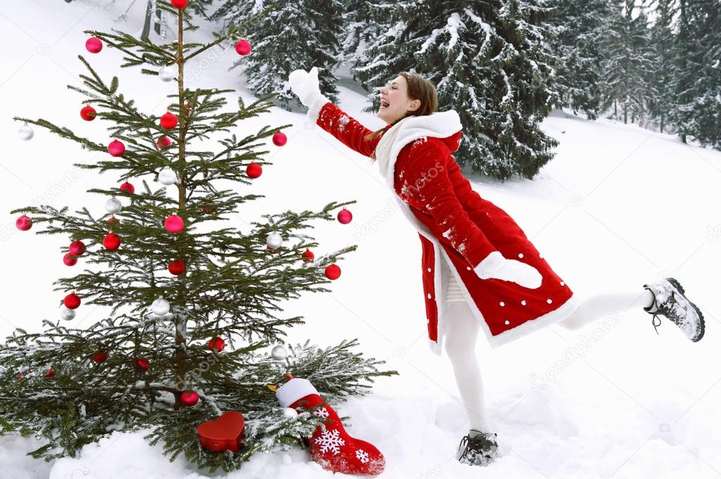 Girl decorating  Xmas tree