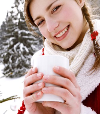 Woman holding a hot cup clipart