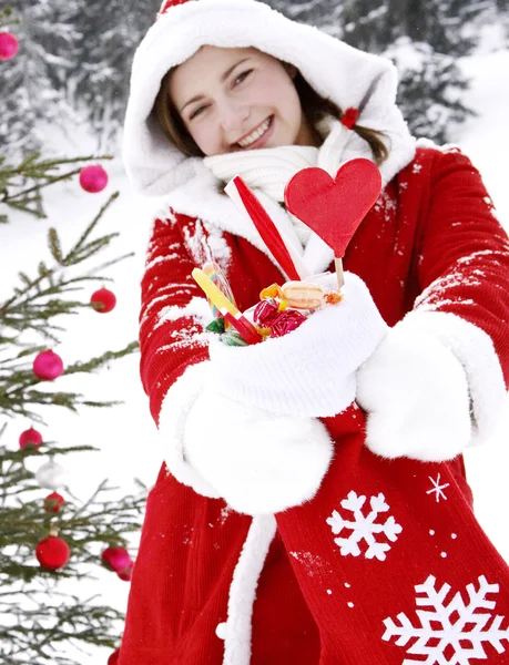 Woman decorating a christmas tree — Stock Photo, Image