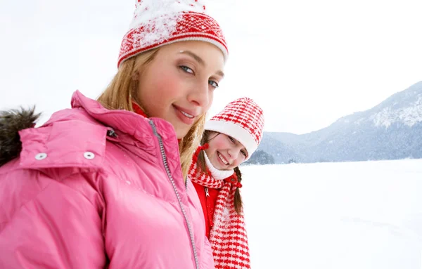 Two young women in winter outdoors — Stock Photo, Image